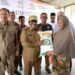 Pj Bupati Aceh Utara Serahkan Bantuan Beras Cadangan 718,400 Ton