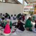 Tingkatkan Literasi Al-Qur’an, Mahasiswa KKN Unimal Kelompok 247 Mengajar Ngaji Anak-anak Cot Ara
